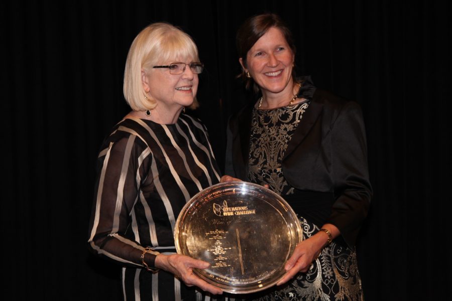 Judith Kennedy presents USA consul general Valerie Fowler with the trophy for the Wine of the Show.